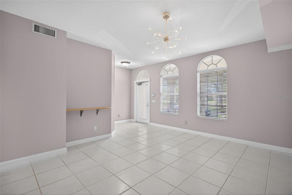 3518 Zanzibar Way Naples, FL 34119 - Photo 6 of 44 a view of an empty room with a window