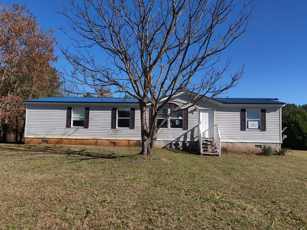 411 Scott Road Elko, GA 31025 - Photo 2 of 27 a front view of a house with a yard