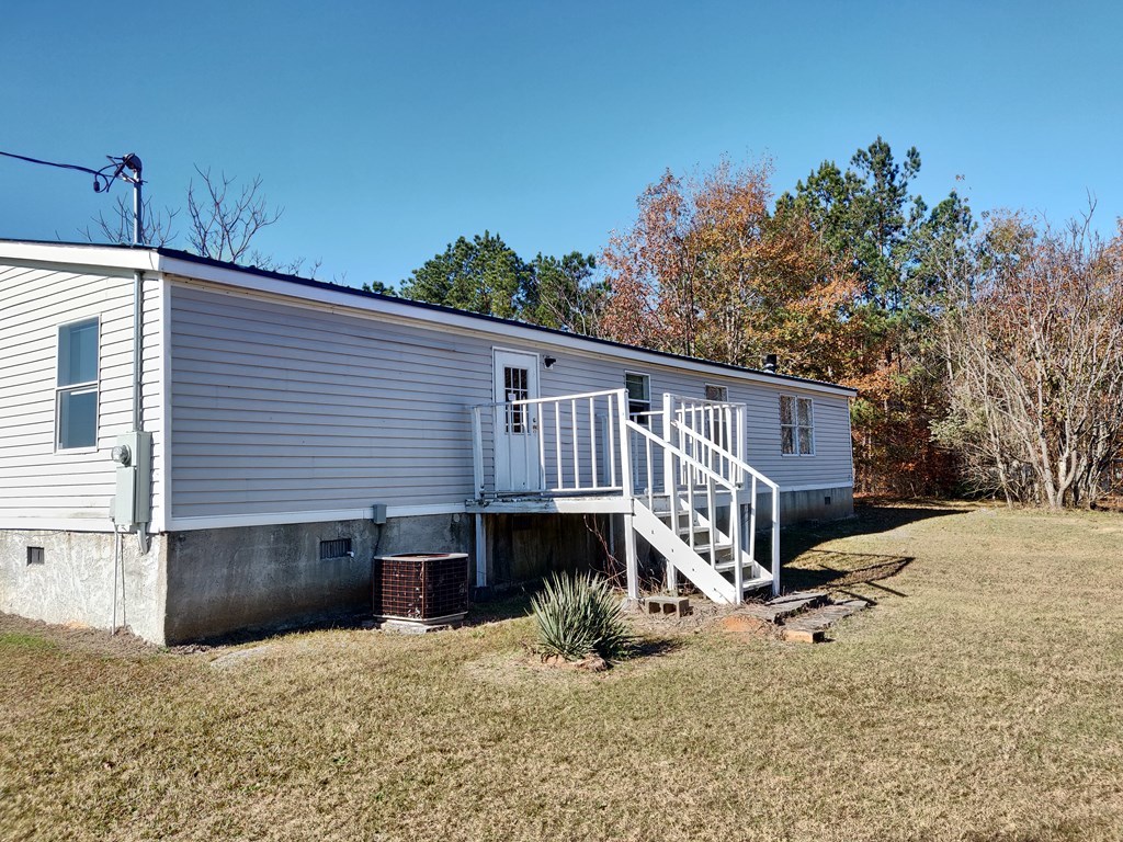 411 Scott Road Elko, GA 31025 - Photo 4 of 27 a view of a house with a yard