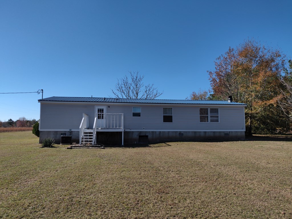 411 Scott Road Elko, GA 31025 - Photo 5 of 27 a front view of house with yard and trees in the background