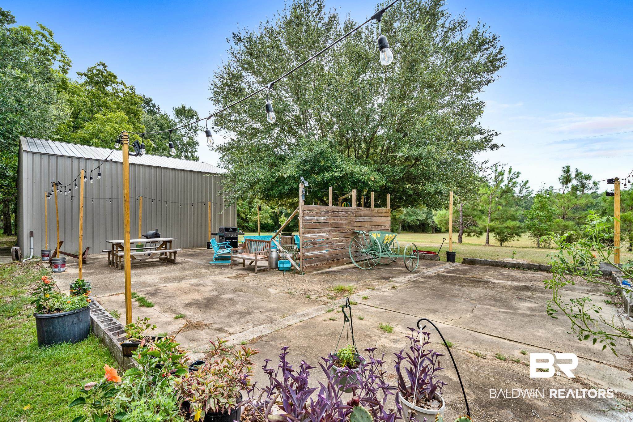 11528 Whitehouse Fork Road Bay Minette, AL 36507 - Photo 30 of 37 View of patio / terrace with an outdoor structure