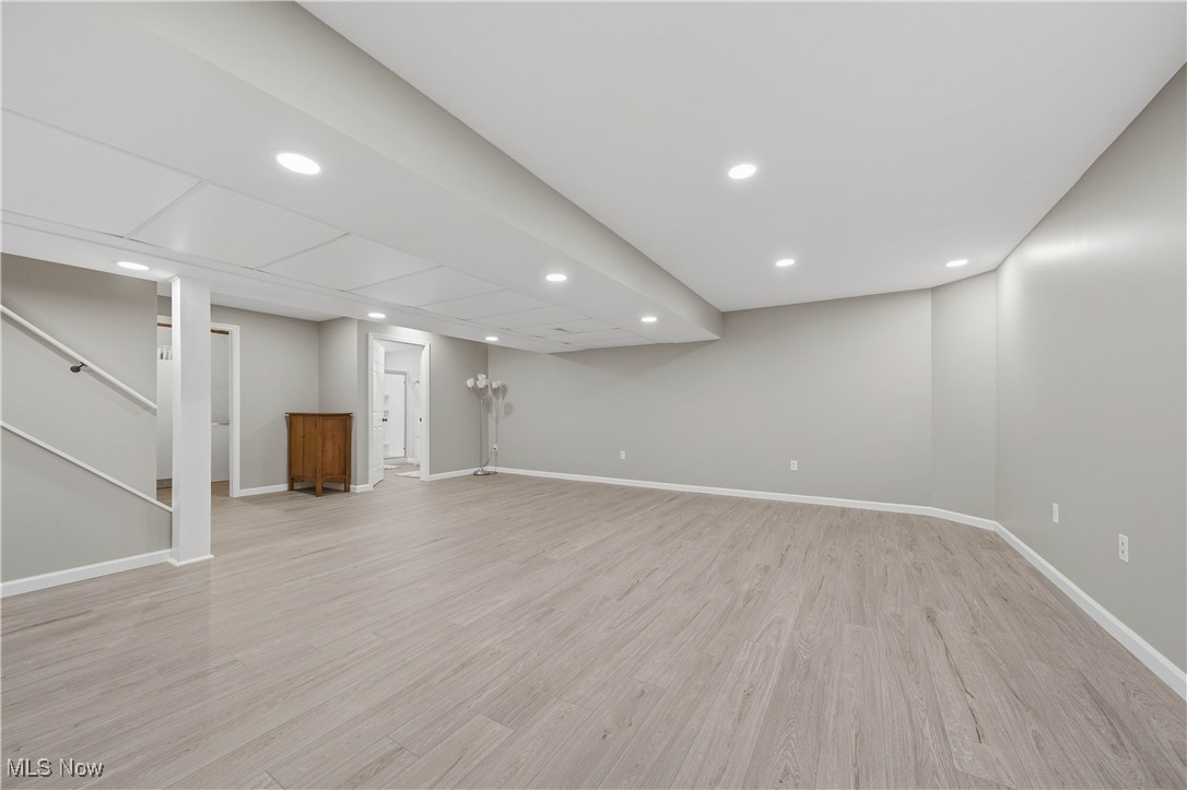 2132 Summerchase Road Northeast Canton, OH 44721 - Photo 36 of 49 Finished below grade area with recessed lighting, light wood-type flooring, and stairway