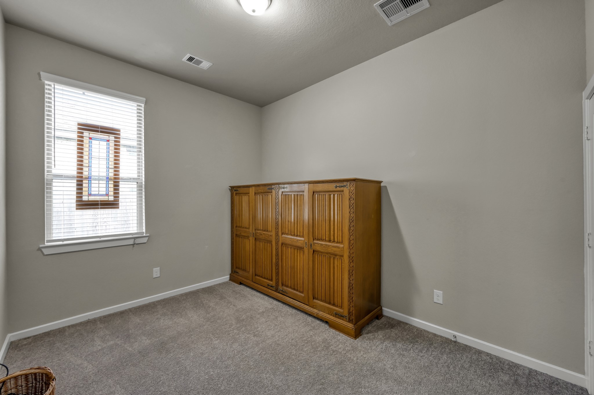 111 Yellow Perch Way Conroe, TX 77318 - Photo 15 of 35 Comfortable secondary bedroom with ample natural light.