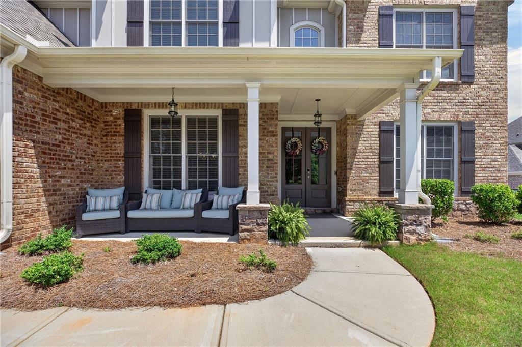 139 Manchester Lane Villa Rica, GA 30180 - Photo 3 of 60 a front view of a building with garden and plants