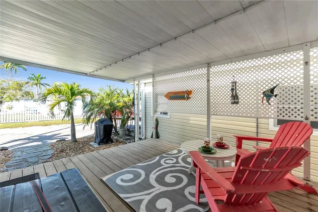 a view of a patio with table and chairs and potted plants