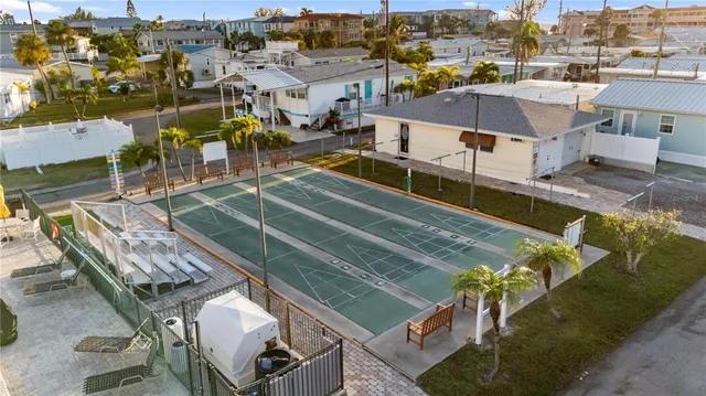 a view of a swimming pool with outdoor seating
