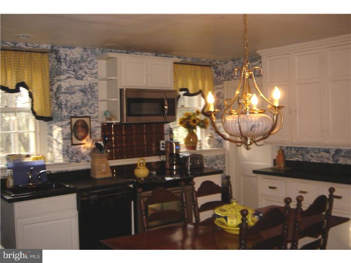 1025 Coates Road Jenkintown, PA 19046 - Photo 14 of 23 a kitchen with a sink cabinets and a stove
