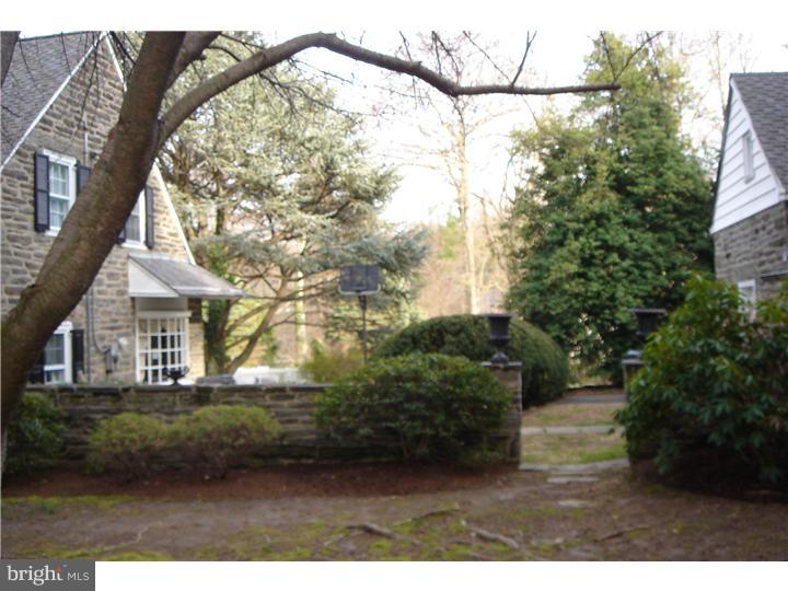 1025 Coates Road Jenkintown, PA 19046 - Photo 21 of 23 a view of a yard in front of a house with a large tree