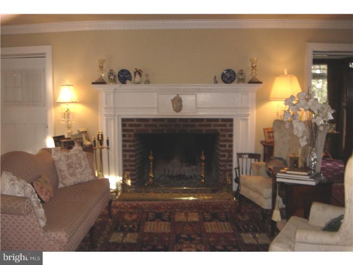 1025 Coates Road Jenkintown, PA 19046 - Photo 4 of 23 a living room with furniture and a fireplace