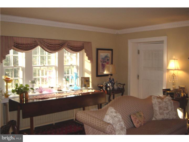 1025 Coates Road Jenkintown, PA 19046 - Photo 5 of 23 a living room with furniture and a large window