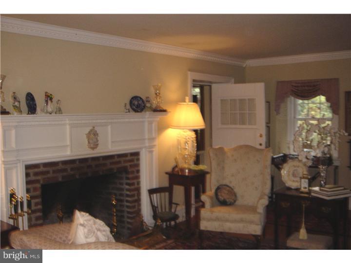 1025 Coates Road Jenkintown, PA 19046 - Photo 6 of 23 a living room with furniture and a fireplace