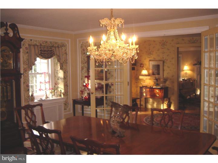 1025 Coates Road Jenkintown, PA 19046 - Photo 9 of 23 a view of a dining room with hardwood floor and chandelier
