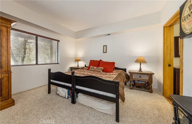 a bedroom with a bed and a desk