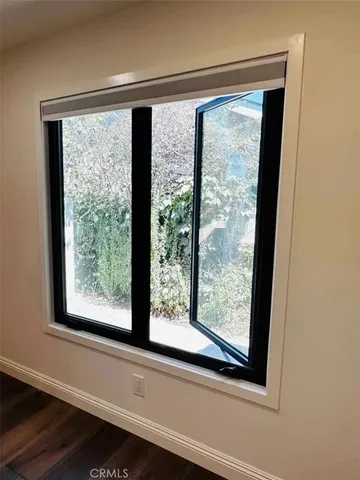 a view of a room that has a large window