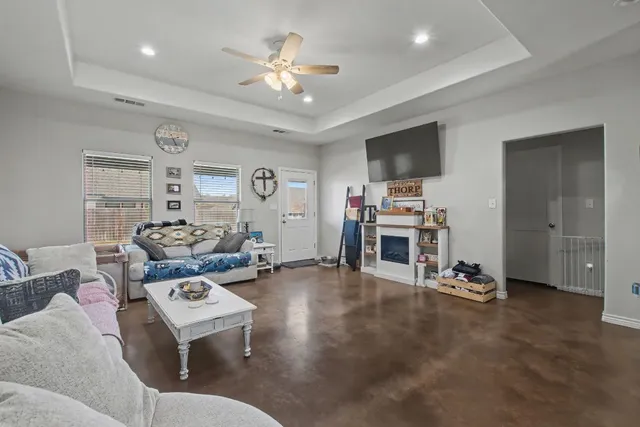 a kitchen with sink a microwave and cabinets