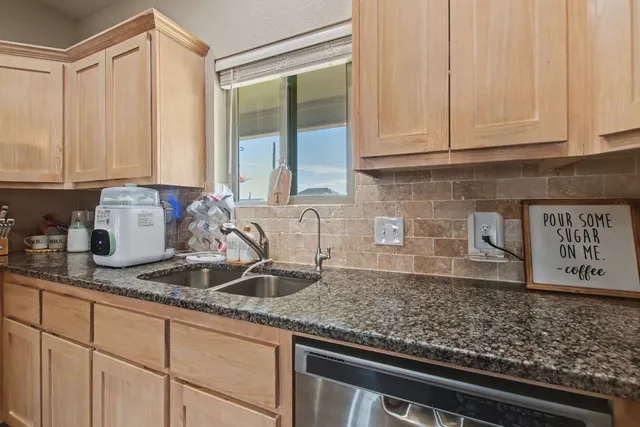 a bedroom with furniture and a window