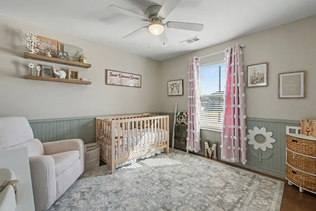 a bathroom with a granite countertop sink toilet and a mirror