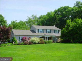 291 Creek Road Doylestown, PA 18901 - Photo 1 of 6 a front view of a house with a yard and trees