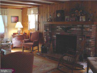 291 Creek Road Doylestown, PA 18901 - Photo 4 of 6 a living room with furniture and a fireplace