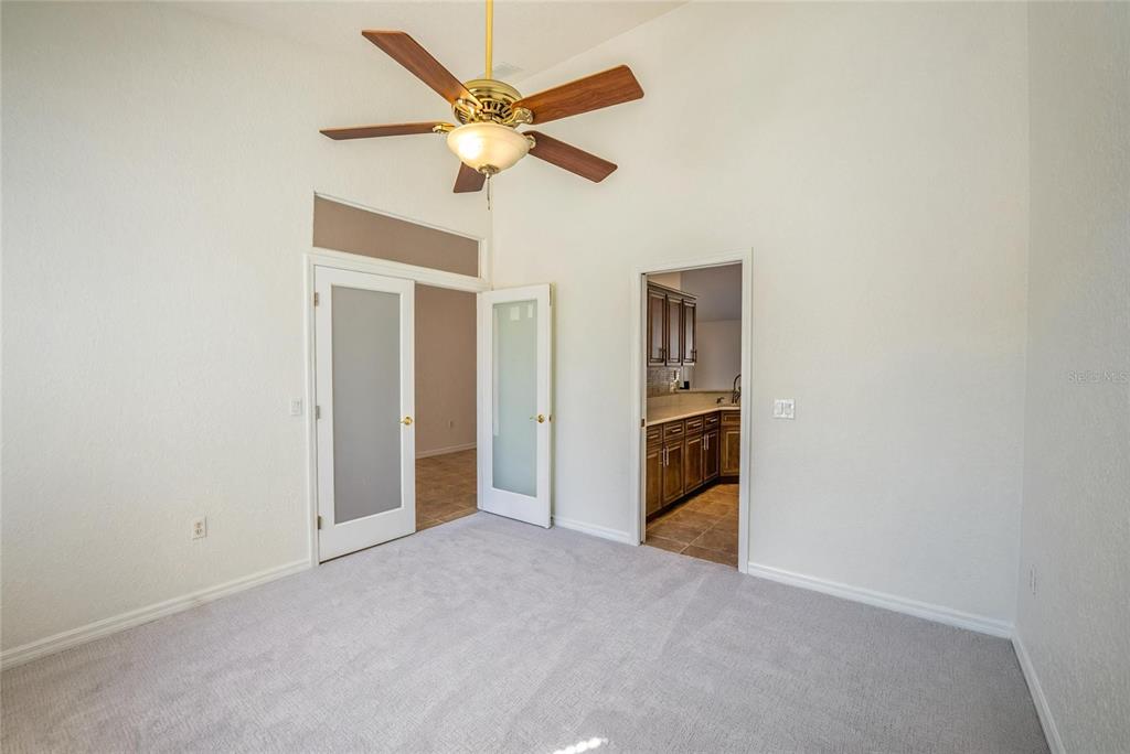 6598 Southeast 11th Loop Ocala, FL 34472 - Photo 14 of 49 an empty room with closet and fan