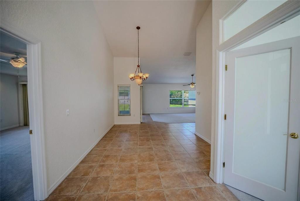 6598 Southeast 11th Loop Ocala, FL 34472 - Photo 16 of 49 a view of a hallway to a bedroom