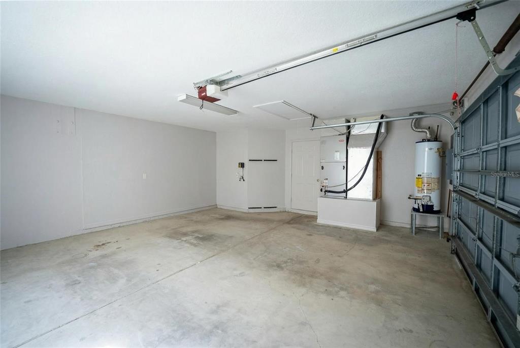 6598 Southeast 11th Loop Ocala, FL 34472 - Photo 26 of 49 en empty room with stairs and windows
