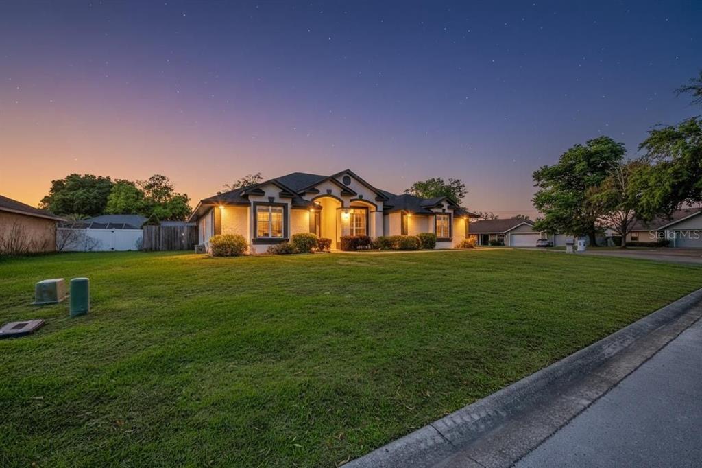 6598 Southeast 11th Loop Ocala, FL 34472 - Photo 29 of 49 a front view of a house with a yard