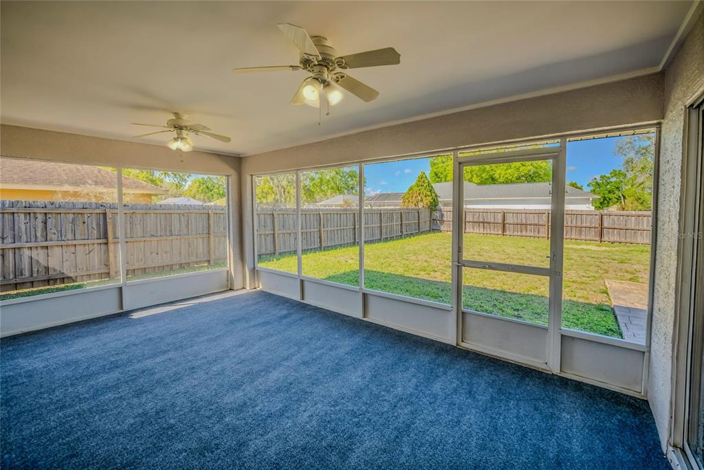 6598 Southeast 11th Loop Ocala, FL 34472 - Photo 3 of 49 a view of an empty room with windows
