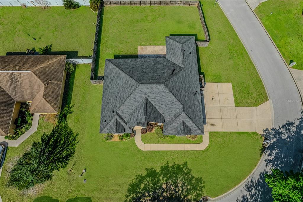 6598 Southeast 11th Loop Ocala, FL 34472 - Photo 46 of 49 an aerial view of a house with garden space and street view