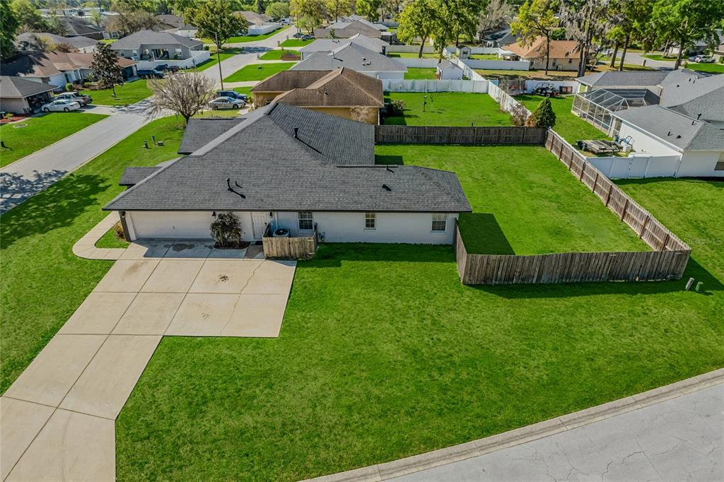6598 Southeast 11th Loop Ocala, FL 34472 - Photo 47 of 49 an aerial view of a house with a garden