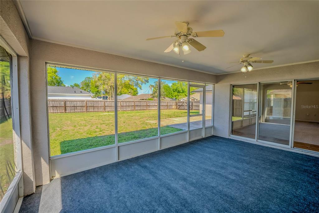6598 Southeast 11th Loop Ocala, FL 34472 - Photo 49 of 49 a view of an empty room with wooden floor and a window