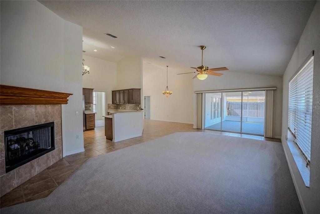 6598 Southeast 11th Loop Ocala, FL 34472 - Photo 5 of 49 a view of an empty room with a fireplace