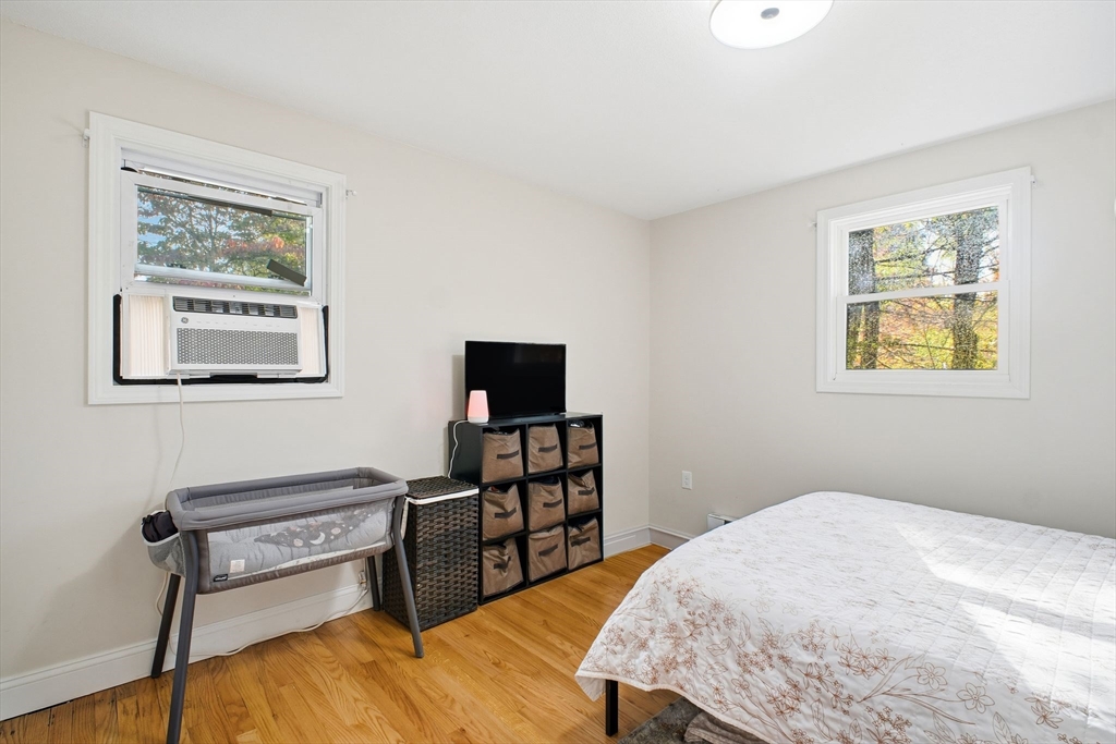 382 North Brook Road Springfield, MA 01119 - Photo 15 of 31 a bedroom with a bed and a flat screen tv