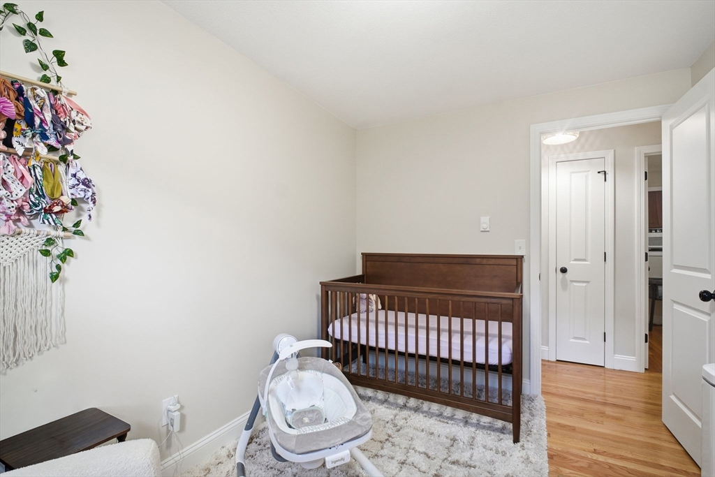 382 North Brook Road Springfield, MA 01119 - Photo 18 of 31 a view of a hallway with wooden floor and a potted plant