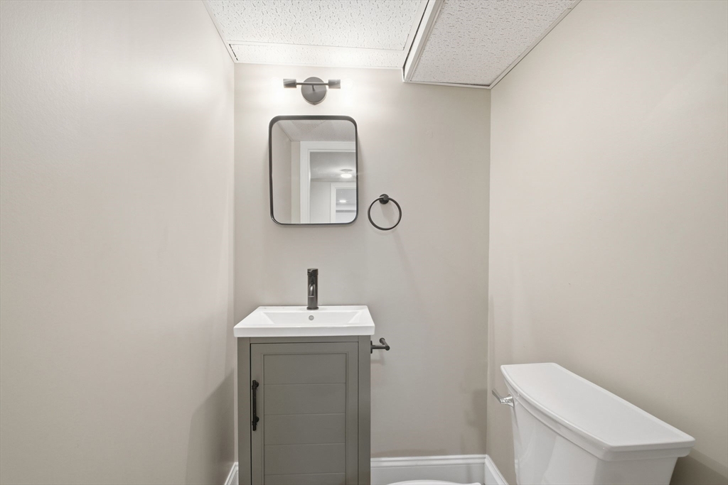 382 North Brook Road Springfield, MA 01119 - Photo 25 of 31 a bathroom with a toilet sink and mirror