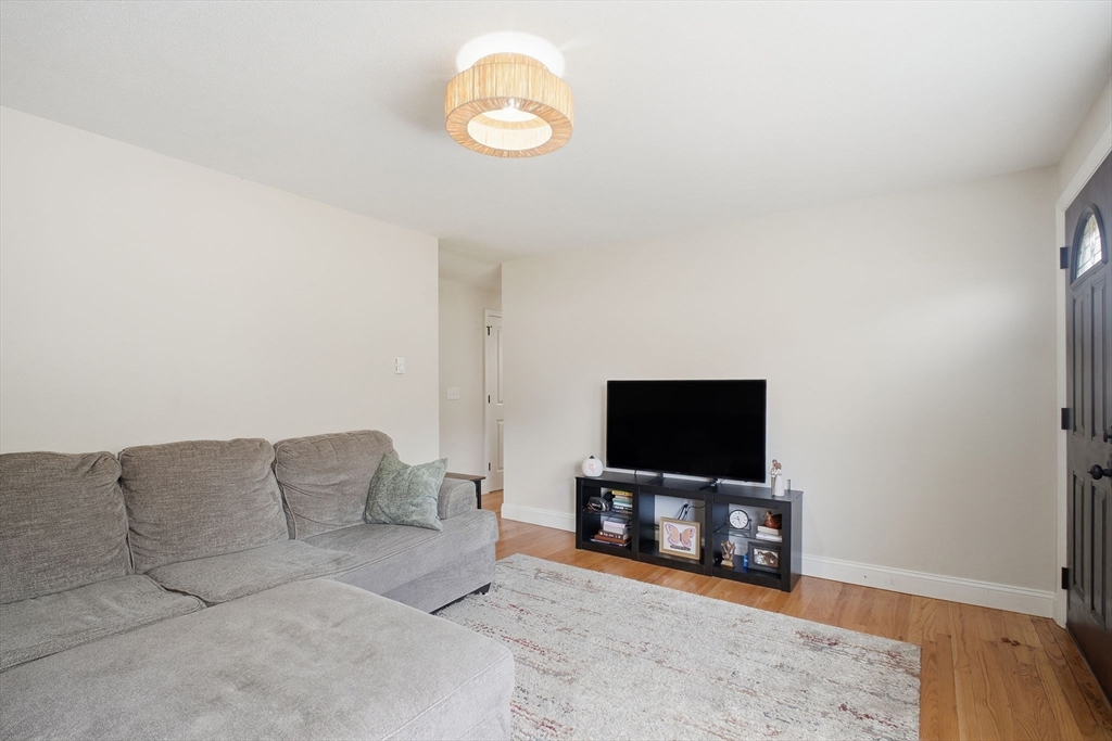 382 North Brook Road Springfield, MA 01119 - Photo 5 of 31 a living room with furniture and a flat screen tv