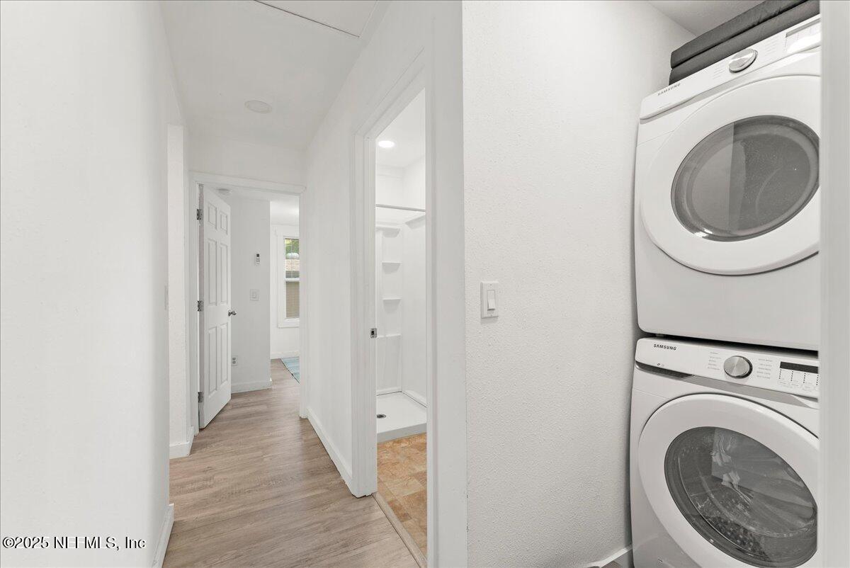 9034 Crystal Springs Road Jacksonville, FL 32221 - Photo 11 of 34 a view of a hallway with washer and dryer