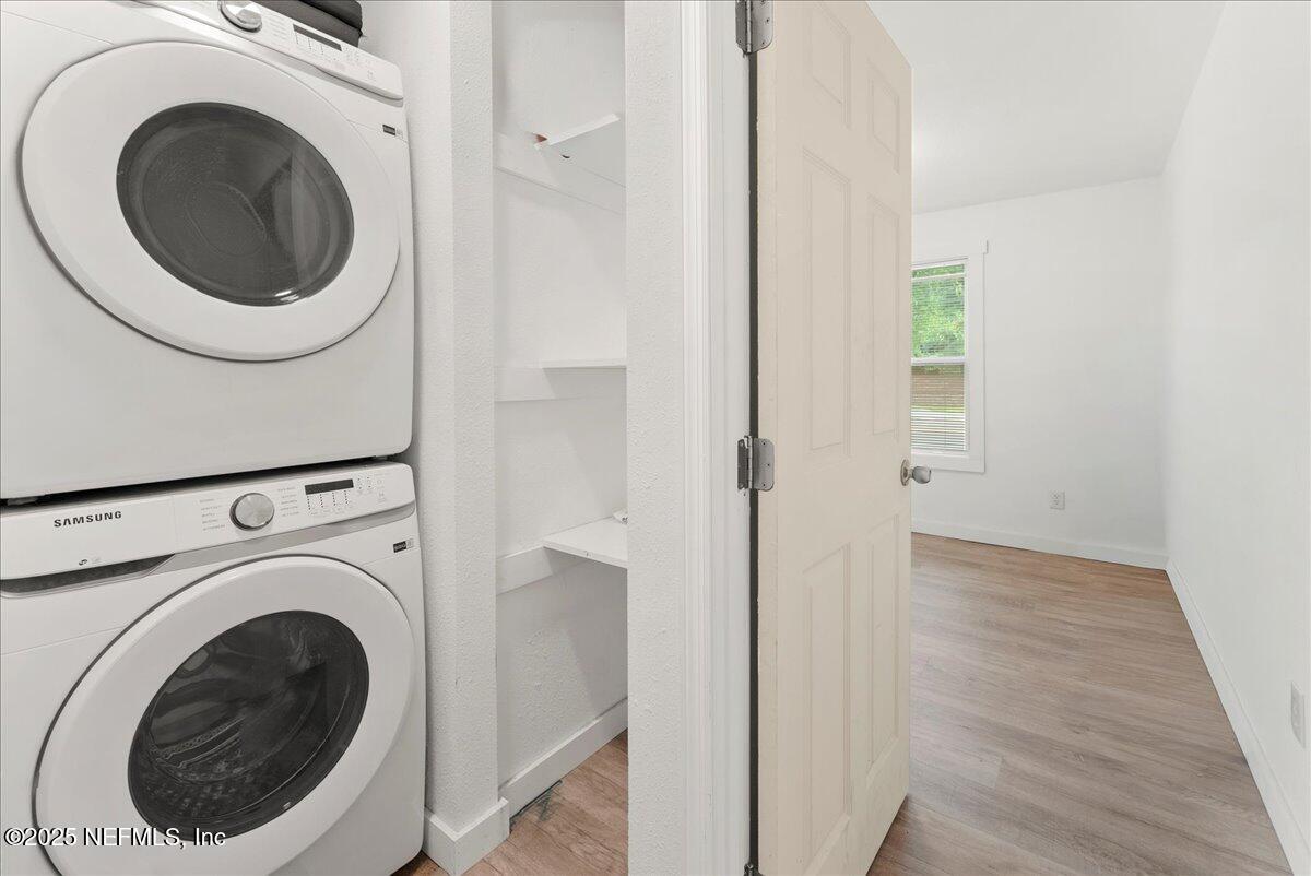 9034 Crystal Springs Road Jacksonville, FL 32221 - Photo 12 of 34 a view of a hallway with washer and dryer