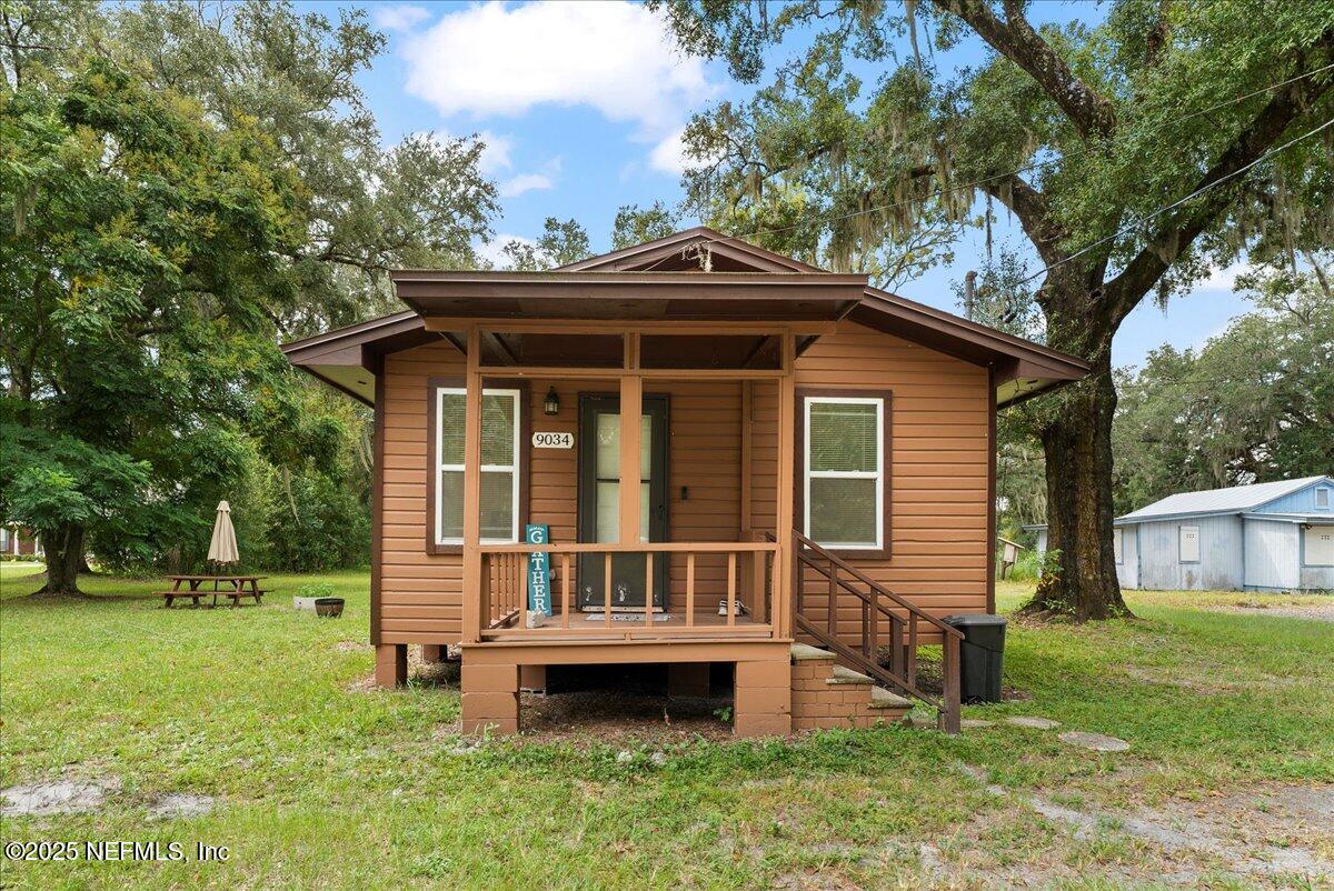 9034 Crystal Springs Road Jacksonville, FL 32221 - Photo 27 of 34 a view of house with a yard