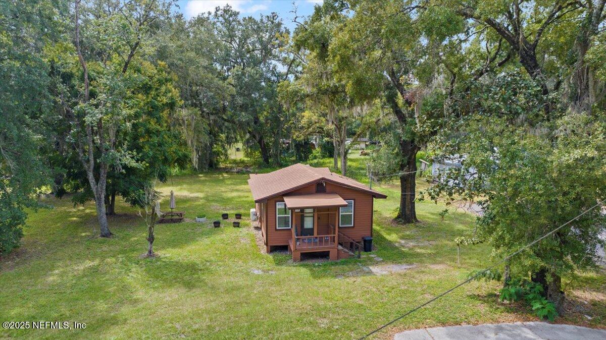 9034 Crystal Springs Road Jacksonville, FL 32221 - Photo 28 of 34 a house view with a sitting space and garden