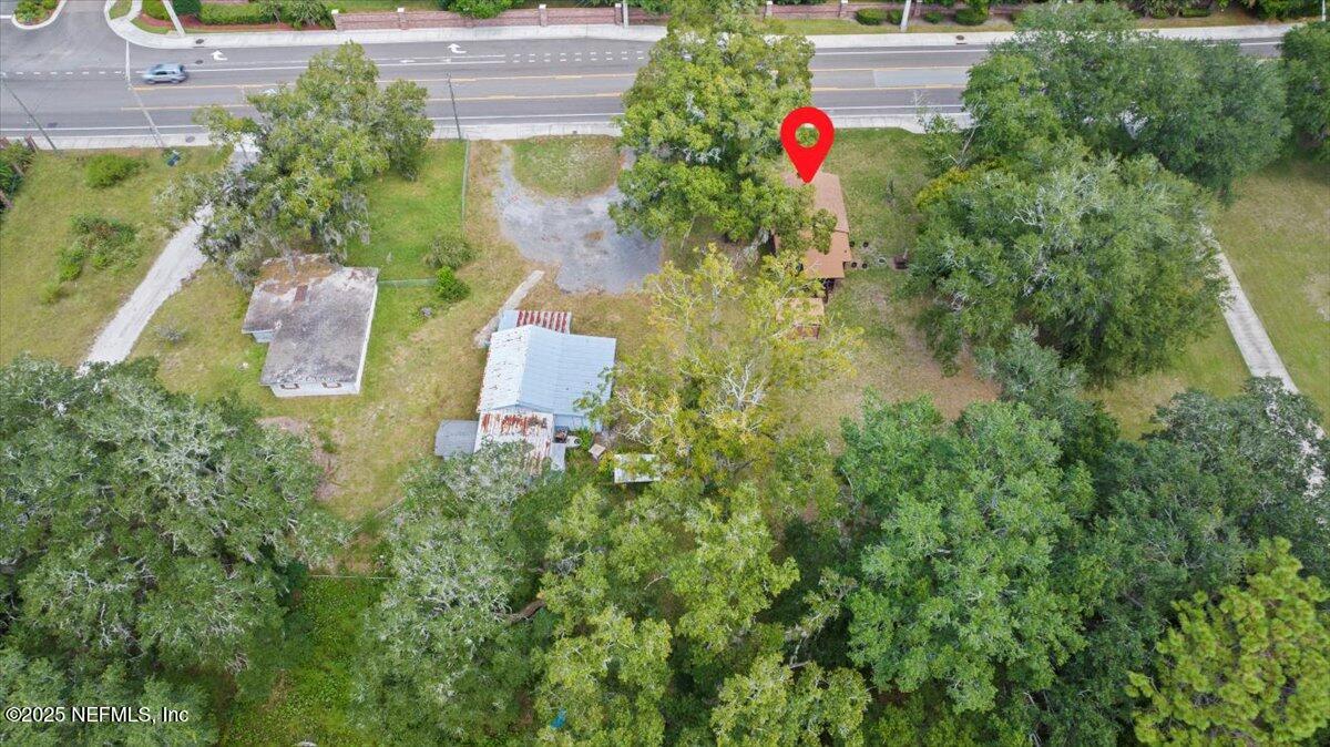 9034 Crystal Springs Road Jacksonville, FL 32221 - Photo 33 of 34 an aerial view of a house with swimming pool and garden