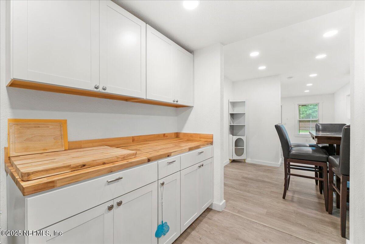 9034 Crystal Springs Road Jacksonville, FL 32221 - Photo 6 of 34 a kitchen with a sink cabinets and wooden floor