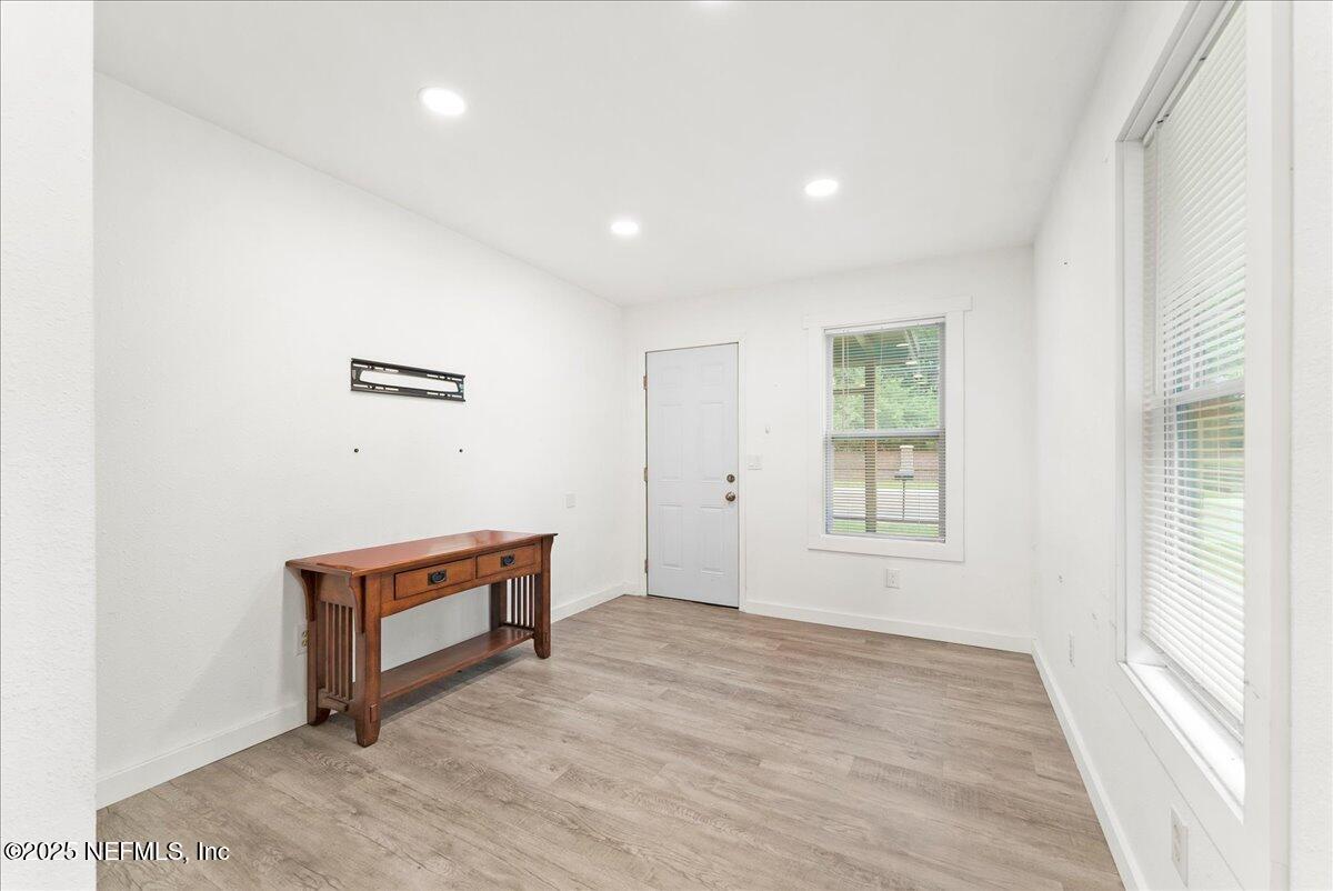 9034 Crystal Springs Road Jacksonville, FL 32221 - Photo 7 of 34 an empty room with windows