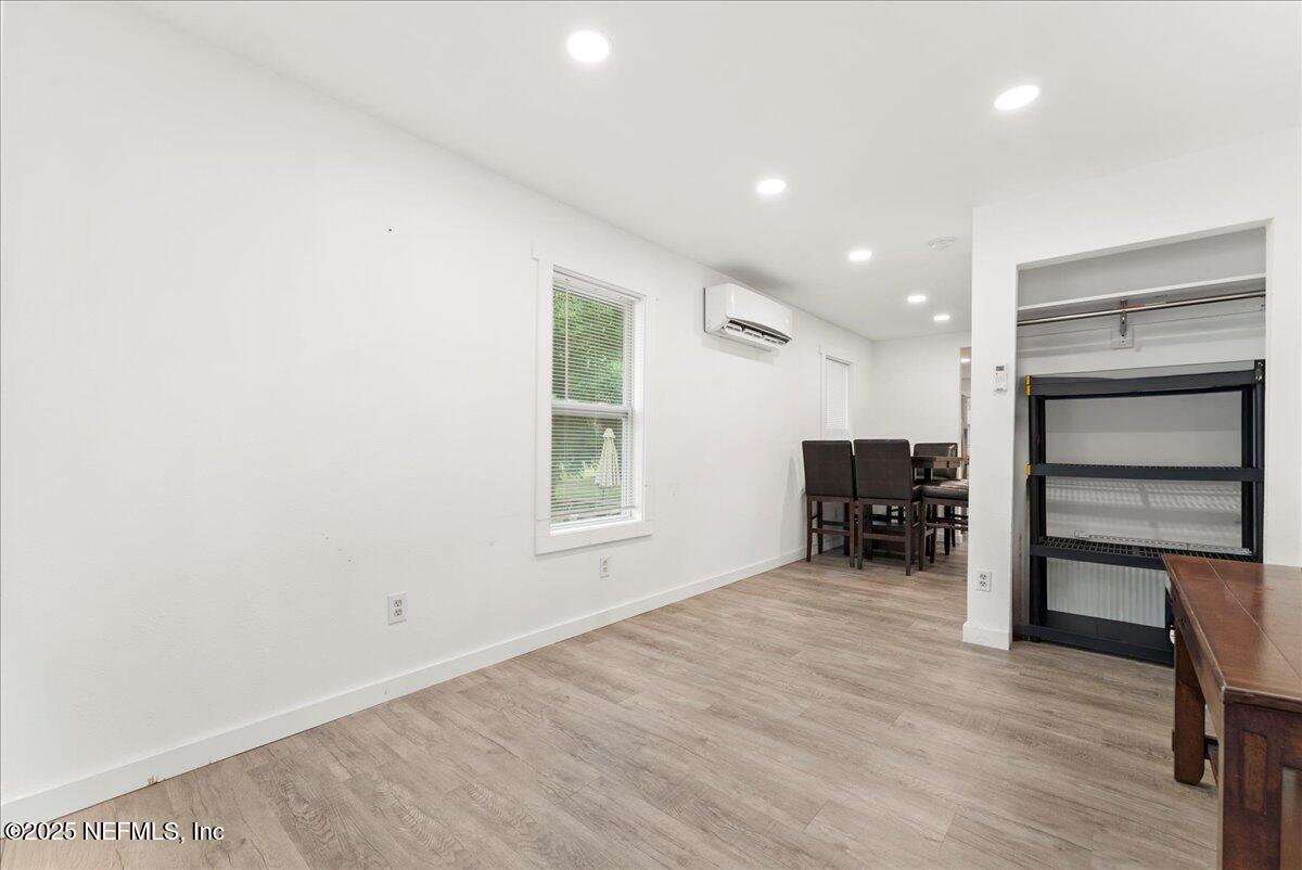 9034 Crystal Springs Road Jacksonville, FL 32221 - Photo 9 of 34 a room with furniture and a window