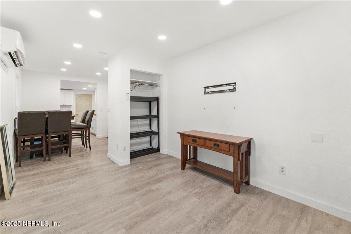 9034 Crystal Springs Road Jacksonville, FL 32221 - Photo 10 of 34 a view of room with furniture and wooden floor