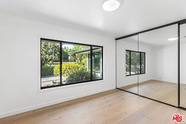 a view of a room with a large window