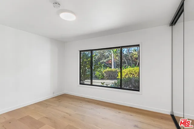 an empty room with large window