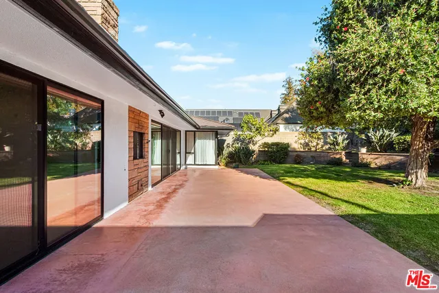 a view of house with yard and green space