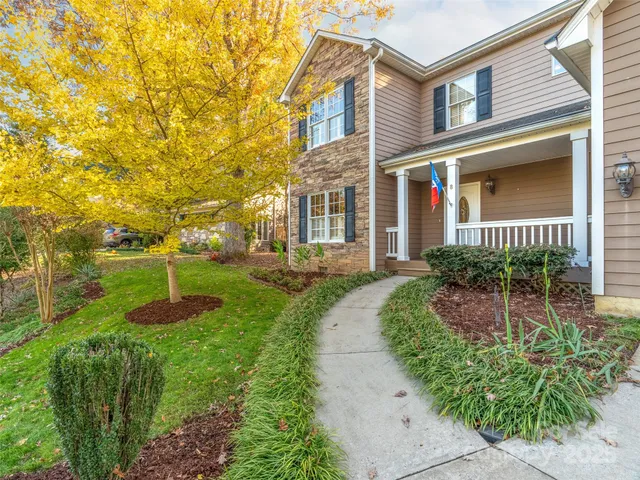front view of a house with a yard