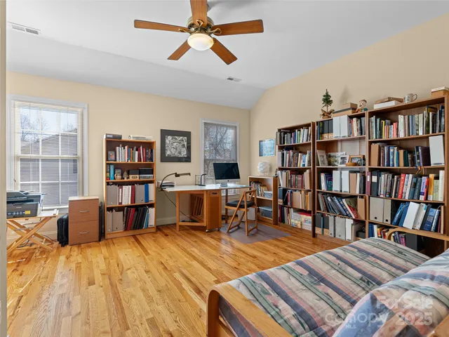 a bedroom with a bed and furniture